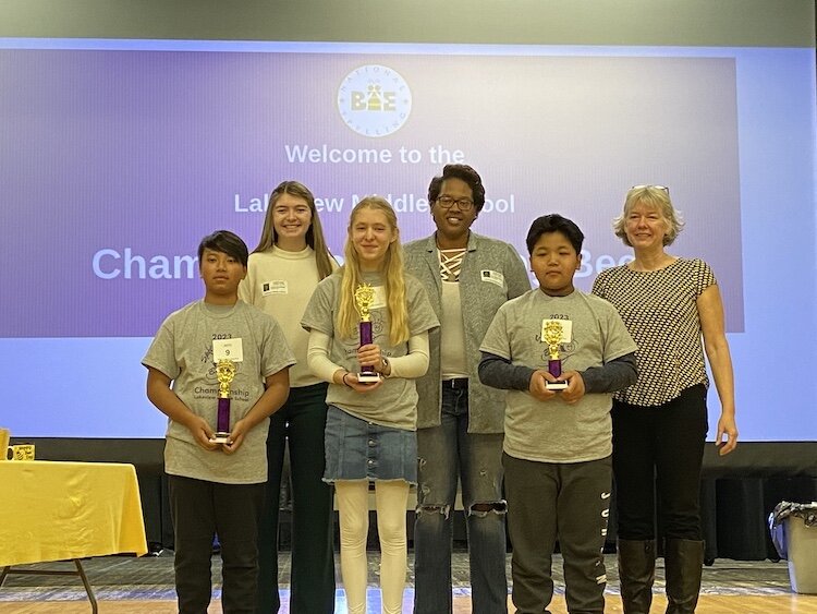 The top three spellers in the Lakeview Middle School Championship Spelling Bee pose with their trophies after the competition.