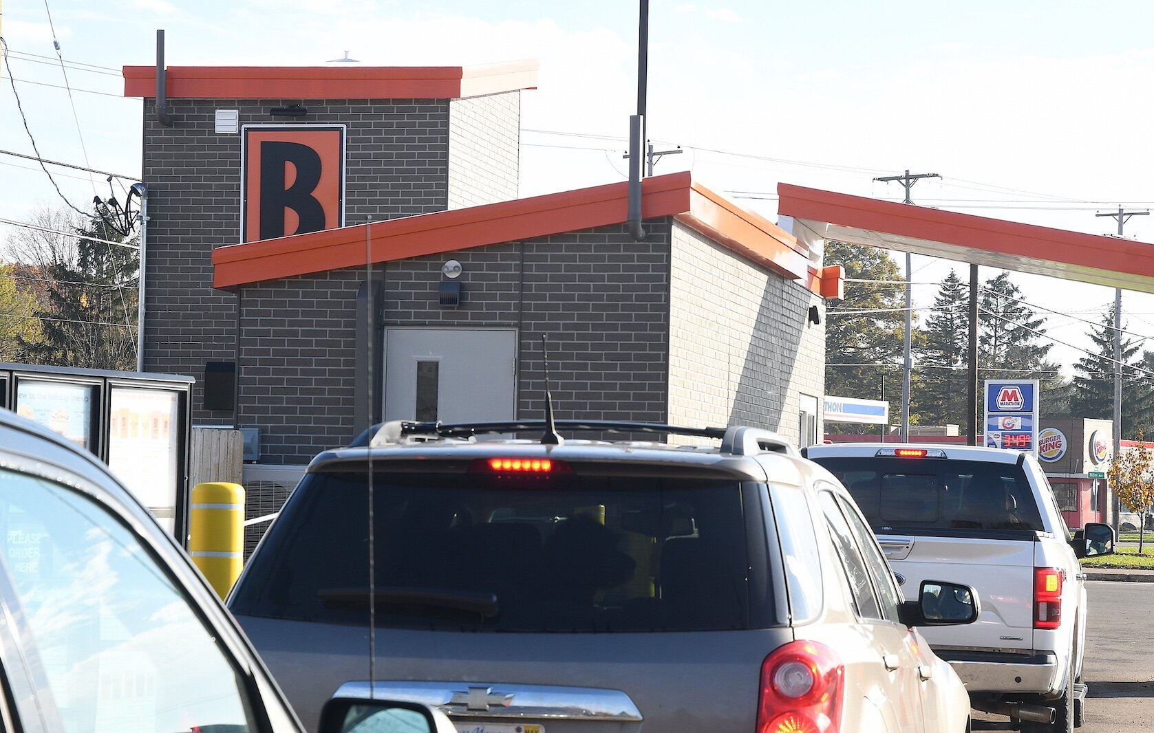 Customers drive up to the newly open drive-up Biggby Coffee shop on West Michigan Avenue in Urbandale.