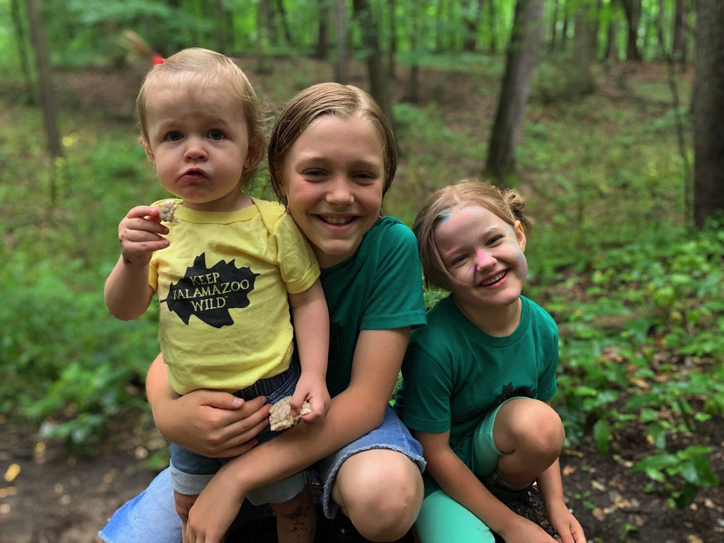 The Pettit Wyzgoski children enjoy exploring the Kleinstuck woods