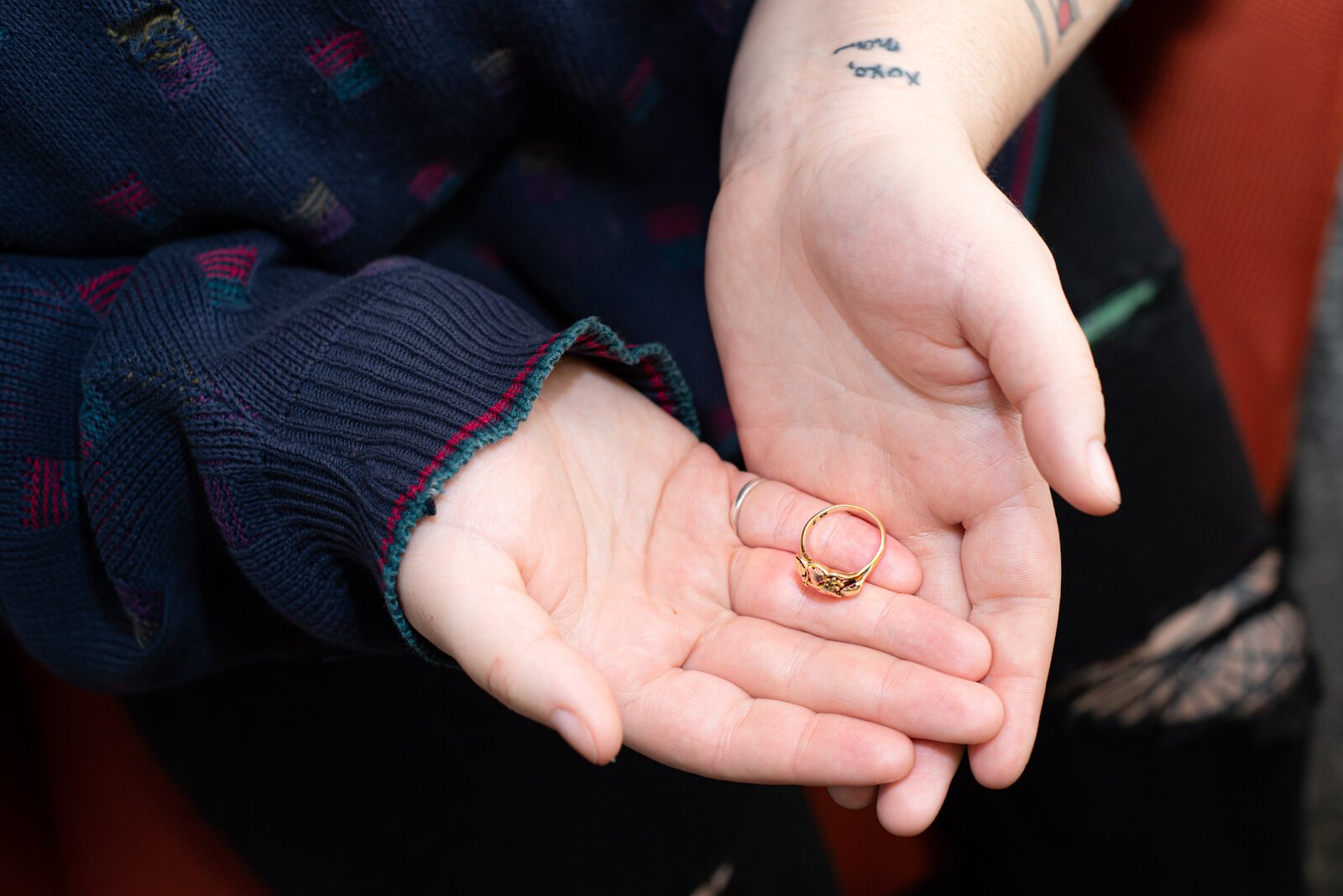 Claudia Holewinski holds her mother's ring, which she always wears.