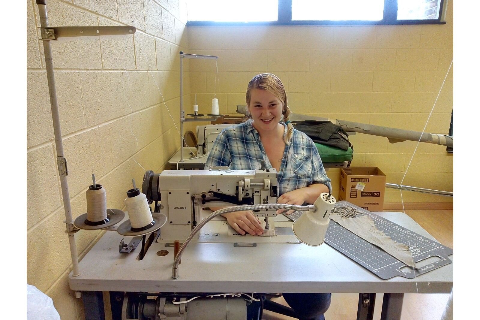 Learning industrial sewing The Women's Co-op.