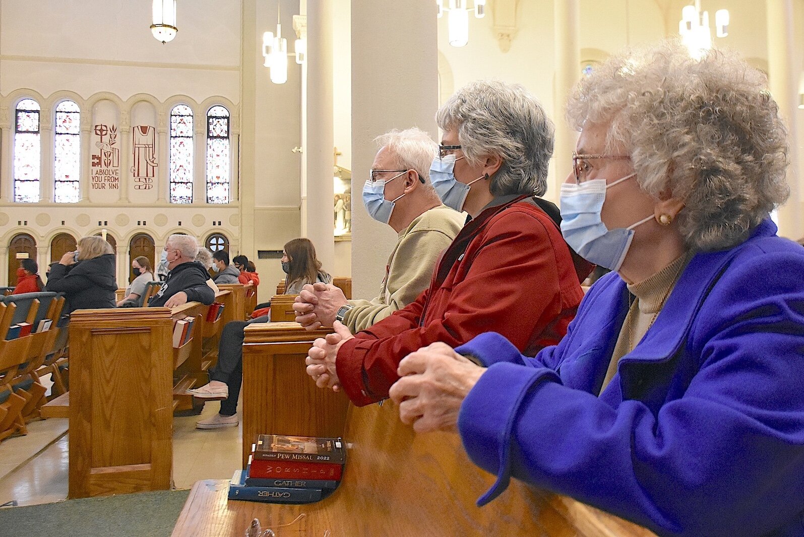 Worshipers wear protective masks at St. Philip Catholic Church in Battle Creek earlier this month.