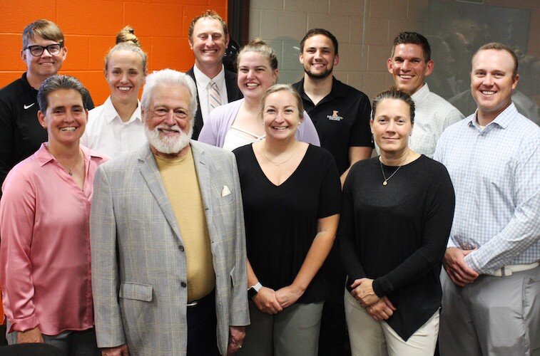 Dana Getman with Director of Athletics Becky Hall and Women’s Athletics Coaches. See full description of those pictured below.