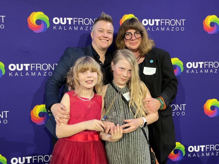 Dell Darnell poses with their wife, Kim Shaw, and two of their daughters.