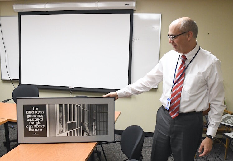 David Makled with photos from retired Judge Sam Durham.