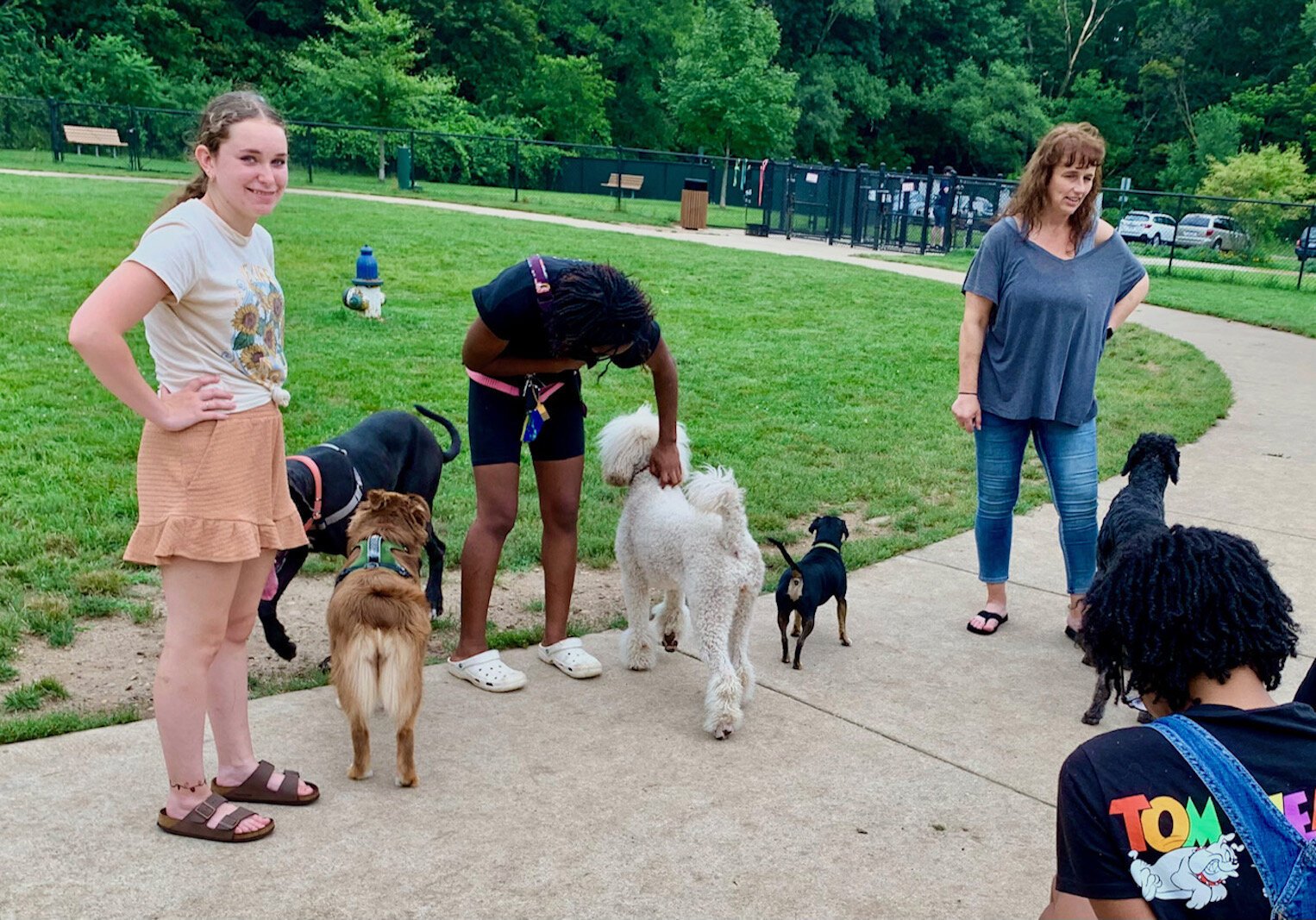 Morgan Rankin, left, and her Australian Shepard, Ivy, meet and greet others Fairmount Dog Park.
