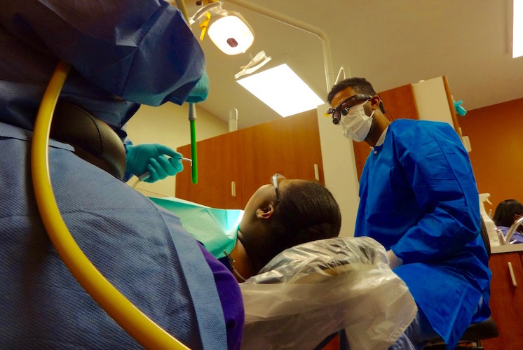 Dr. Haitham Eljack works with a patient at FHC Dental
