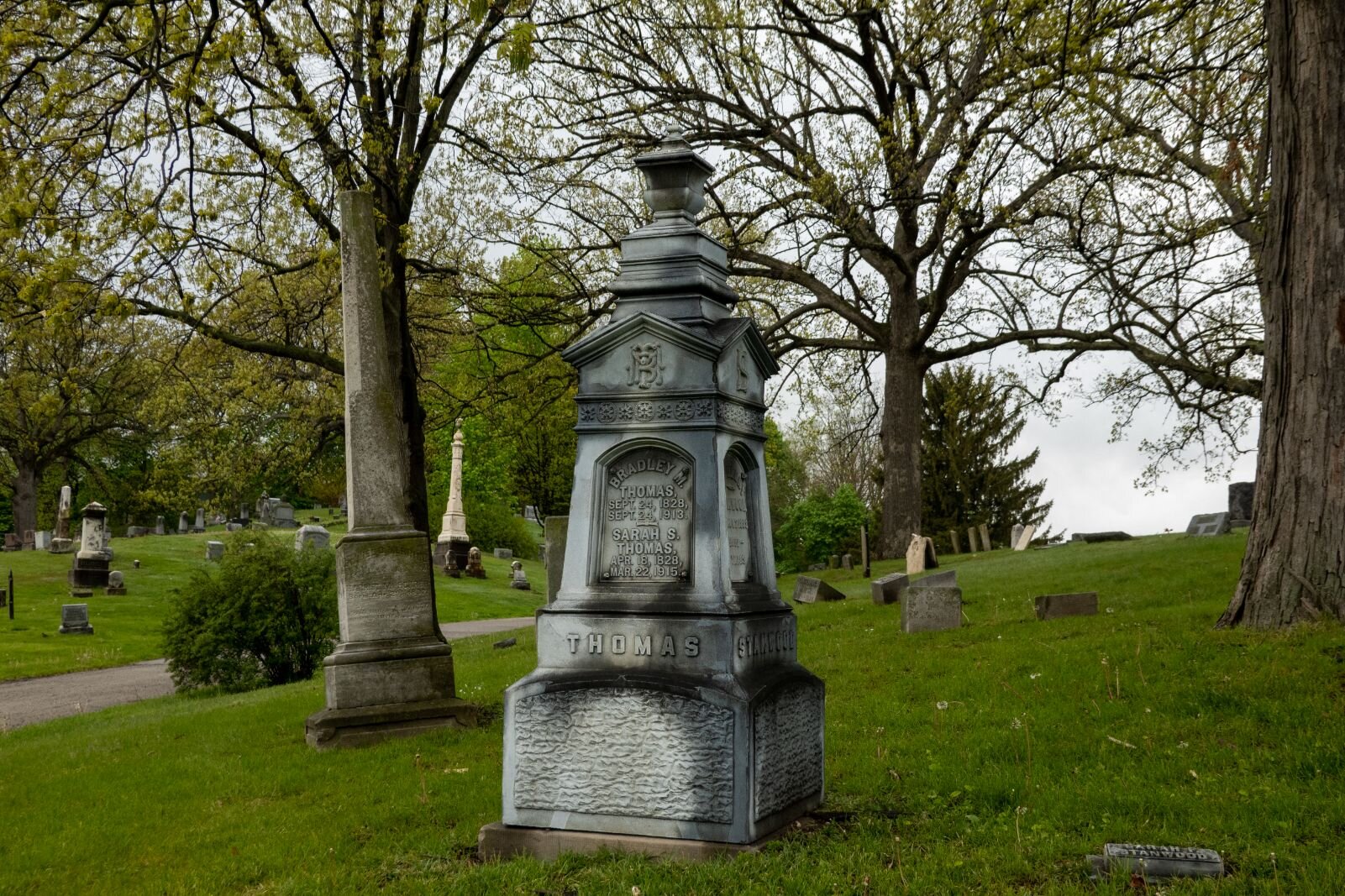 In the 1800s and early 1900s, tombstones were fashioned in many different styles, including ones like this one, which was called white bronze. It was actually it’s made our of zinc carbonate.