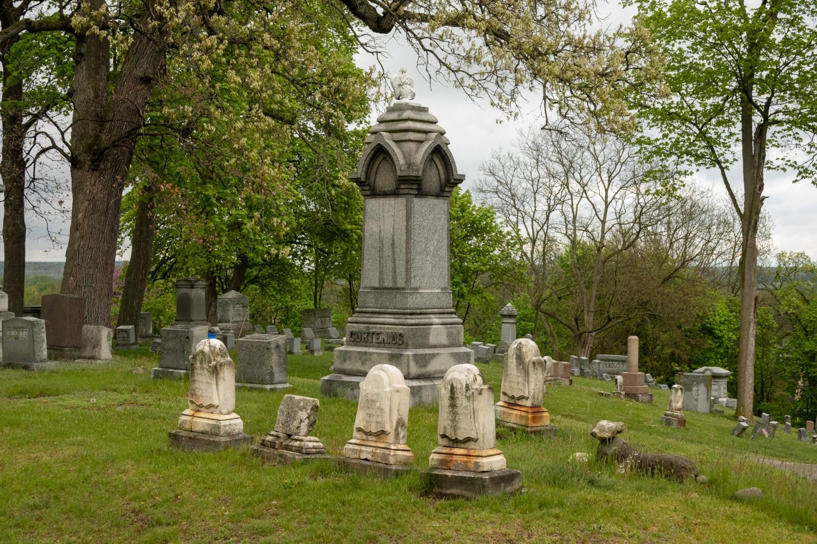 A stone carving of a small animal, such as the lamb below and to the right in this photo of the Cortenius family plot, were sometimes included near the gravesites of children, supposedly to watch over them. 