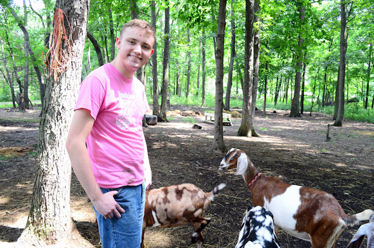  AACORN program participant Greg Bassett shows off the goats.