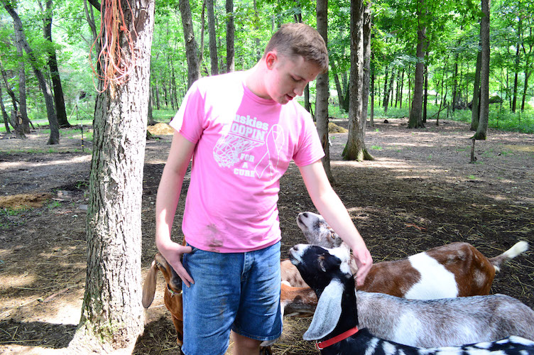  AACORN program participant Greg Bassett shows off the goats.