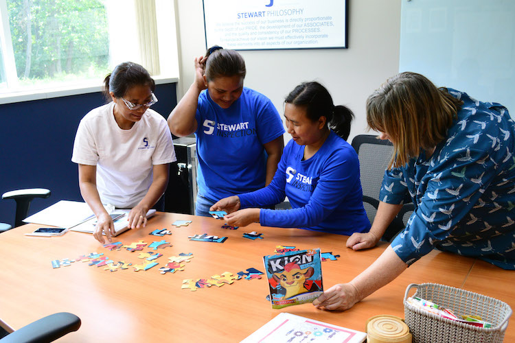 ESL students learn the words ”corner, edges, interior, exterior” through a jigsaw puzzle.