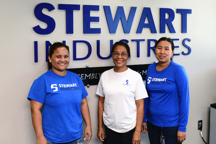 Tluang Hnem, Remh Thanzam and Vung Cing are three of seven Burmese refugees employed at Stewart.