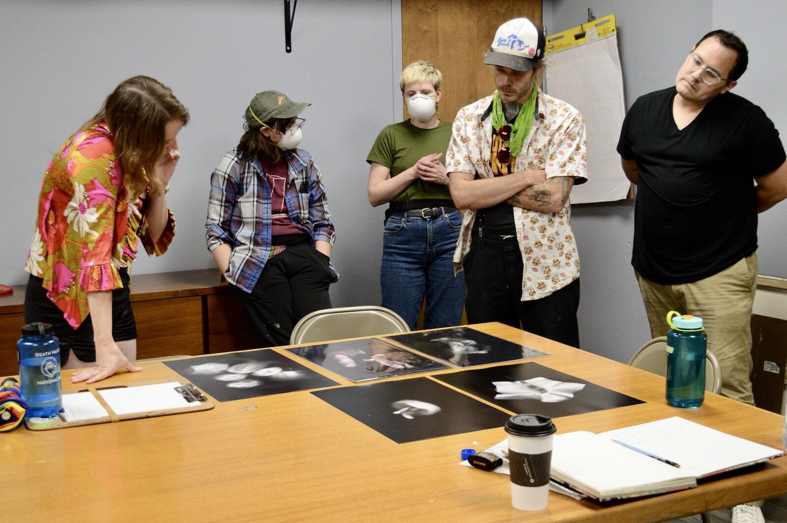 Ellen Nelson, Qynce Chumley, Marissa Klee-Peregon, Daniel Staggs and C. J. Kins examine Klee-Peregon's scanner images of objects.