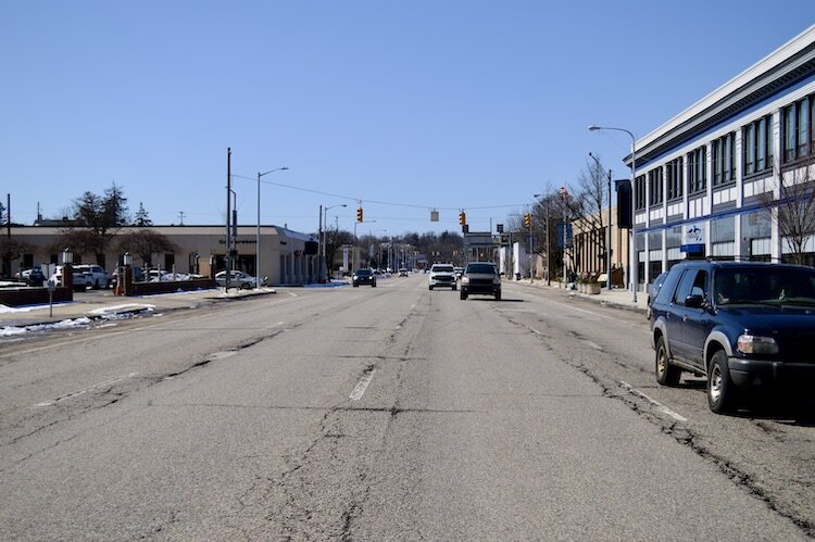 This summer the city will reduce Michigan Ave.'s five-four lanes of traffic to three narrower lanes; will keep parking and add a bike track. 