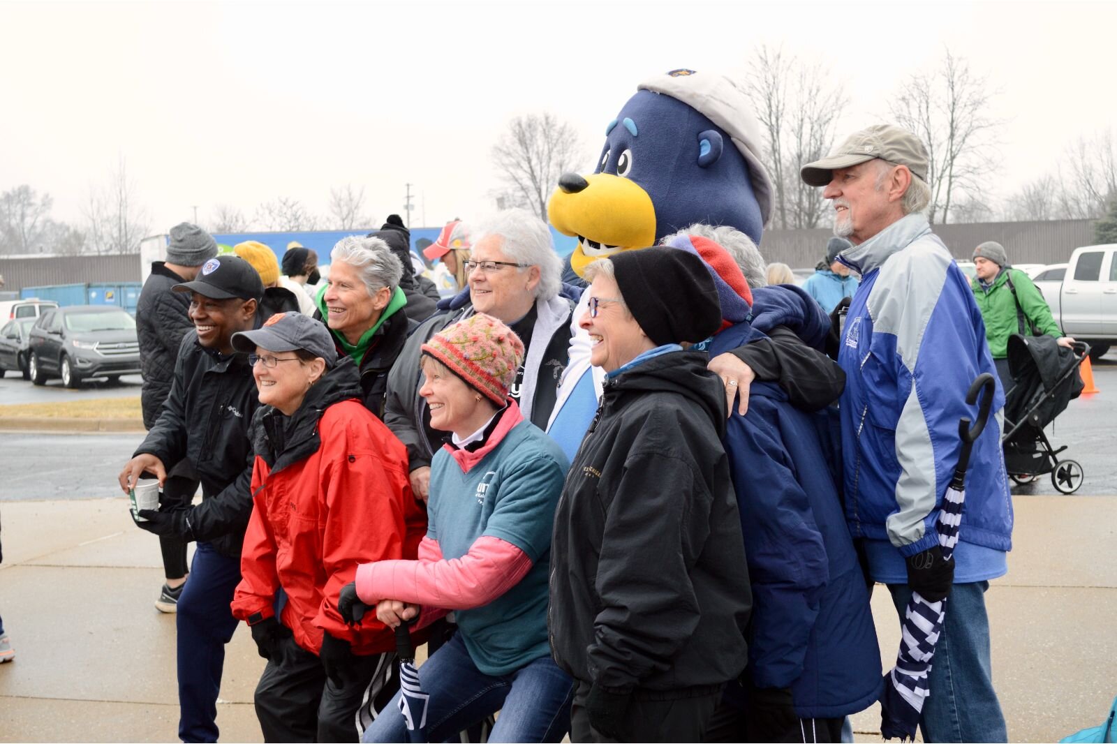  In spite of the weather, the mood was festive as people gathered for the walk.