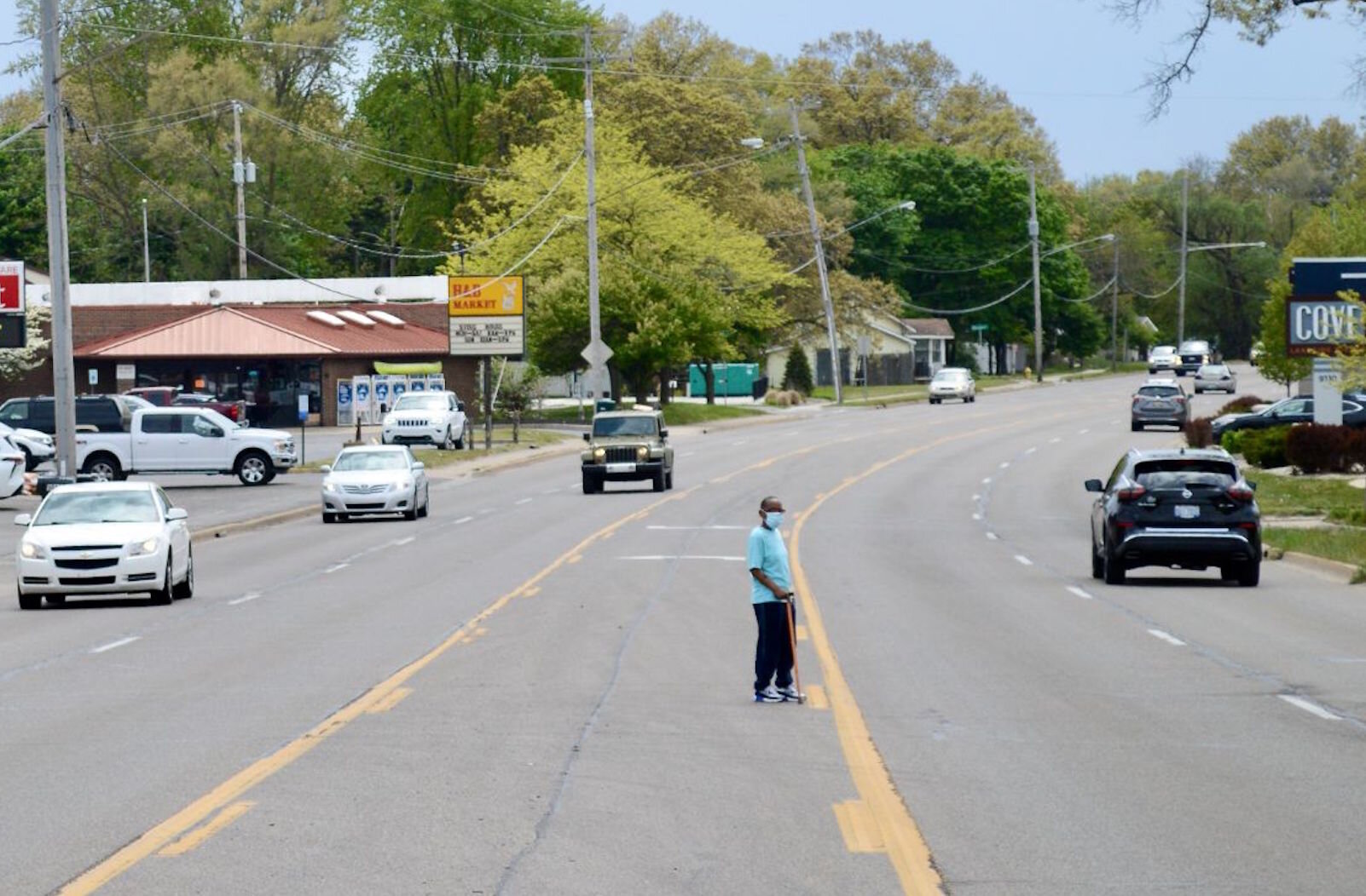 A man with cane attempts to cross the five lanes of Portage Road. The 2.5 mile study area between Center and Osterhout has four crosswalks across Portage, only one of those is in the business/residential-packed isthmus between Forest and Lakeview.  