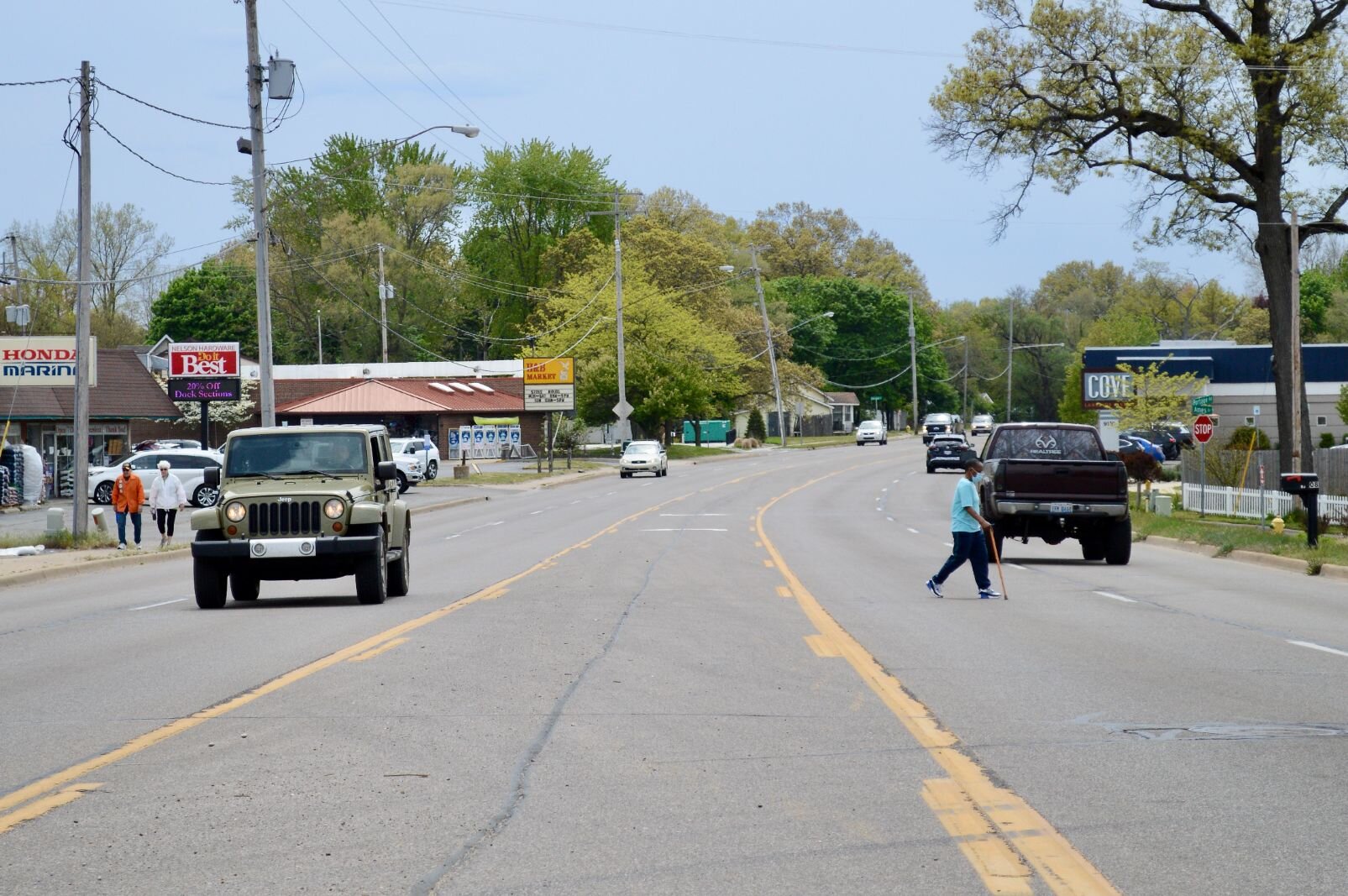 A man with cane attempts to cross the five lanes of Portage Road. The 2.5 mile study area between Center and Osterhout has four crosswalks across Portage, only one of those is in the business/residential-packed isthmus between Forest and Lakeview.  