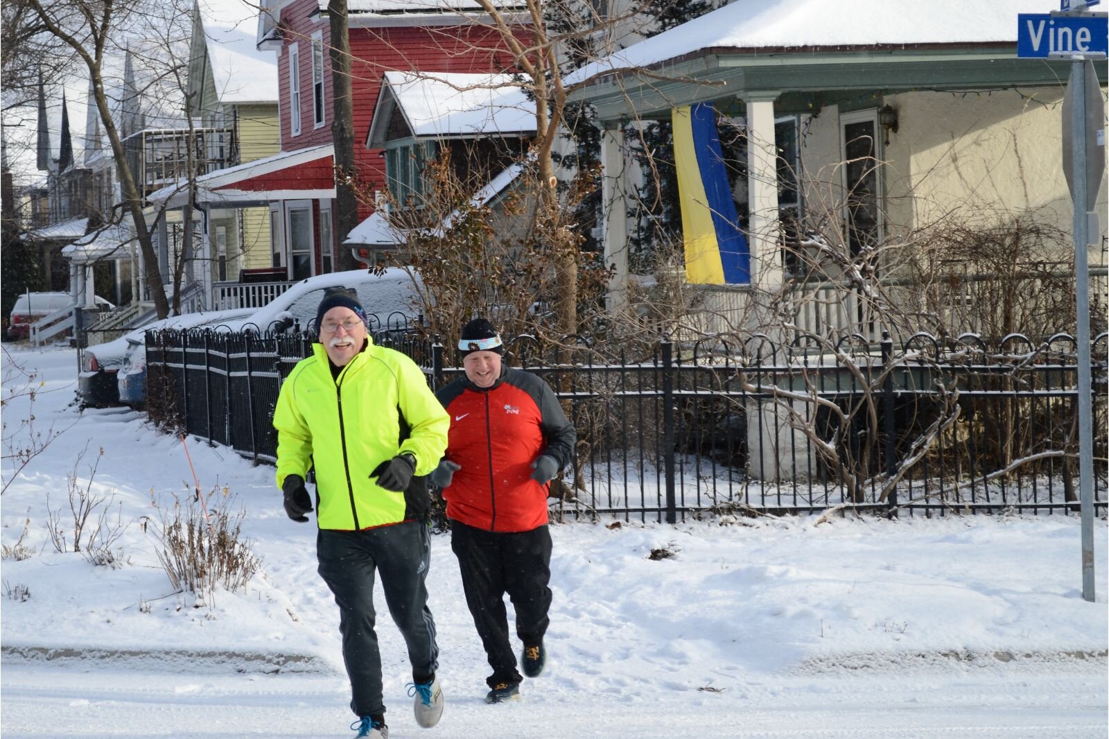 Tom Weissert (left) hits the snowy streets of Kalamazoo. He says, "You run on that collective motivation. Everybody is encouraging everybody else. It's a very inclusive democratic process. All body shapes, all ages, all backgrounds."