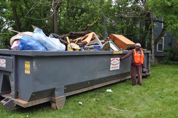 A dumpster full of items collected in Ada Street cleanup.