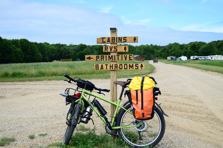 Follow the arrow to Primitive. Kal-Haven Outpost campgrounds.