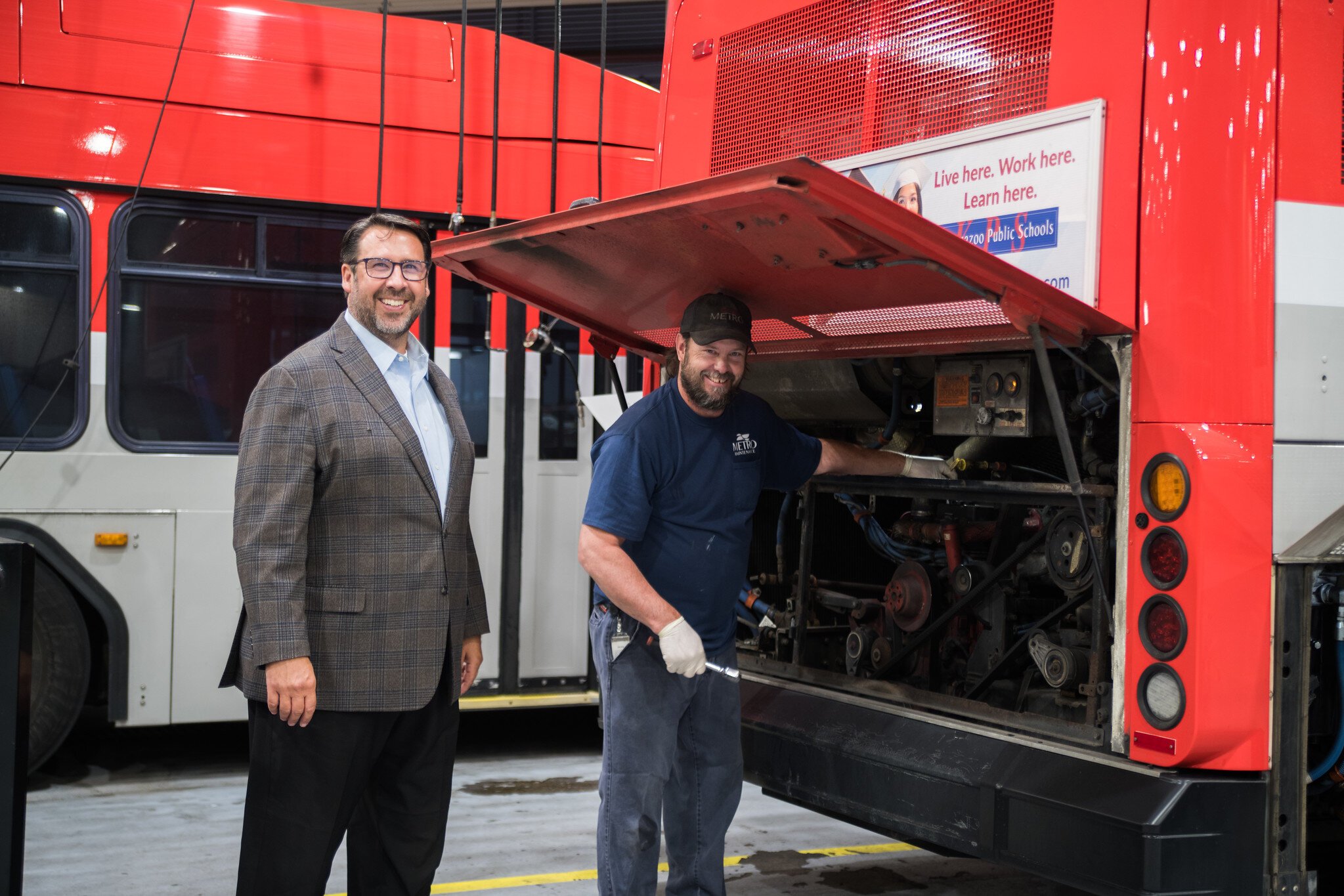 Sean McBride, executive director of Kalamazoo Metro Transit, with one of MetroTransit's 130 employees.