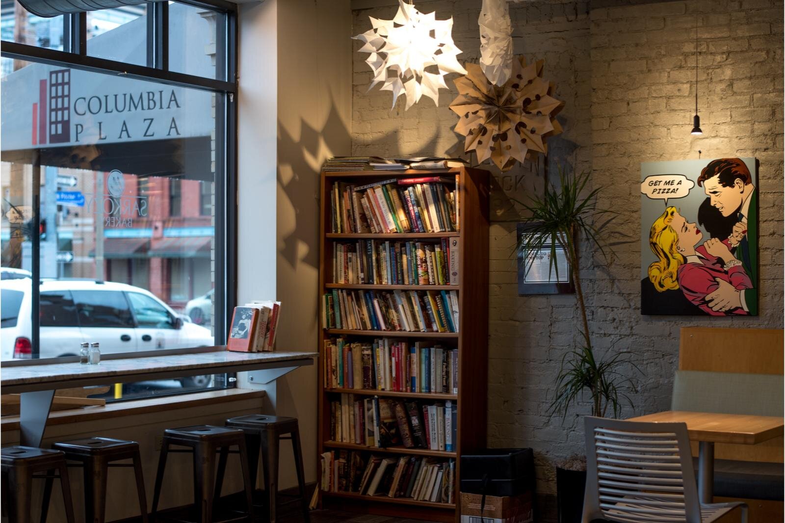 A cozy nook  filled with books at Sarkozy's Bakery.