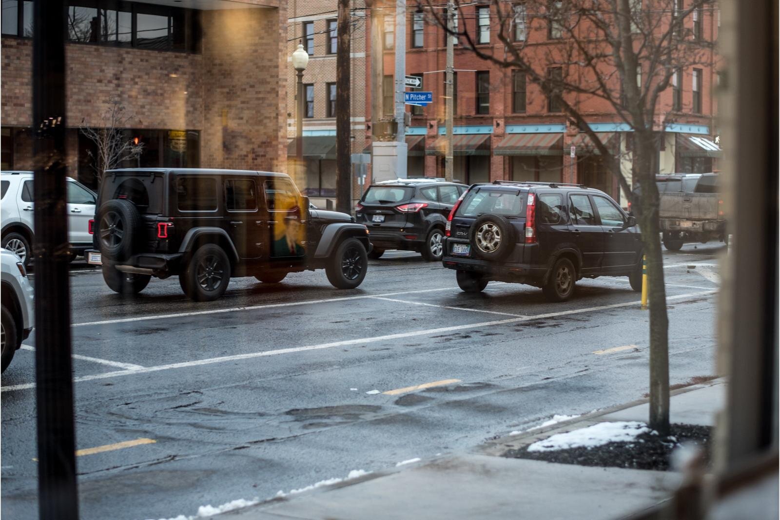 A view of the one way of Michigan Avenue from the Sarkozy Bakery window.