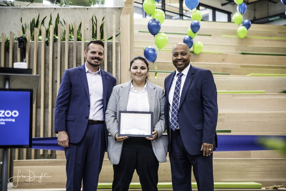 Eric Stewart, Kalamazoo RESA Assistant Superintendent for Career and Talent Development,  Anna Cool Community Engagement Specialist for Governor Gretchen Whitmer, and Dr. Dedrick Martin, KRESA Superintendent, pose with a state certificate.