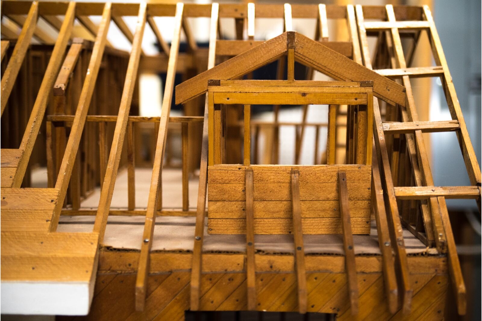 Community Homeworks workshops use models showing house structures, furnaces, plumbing installations, and other items homeowners might be able to repair themselves.