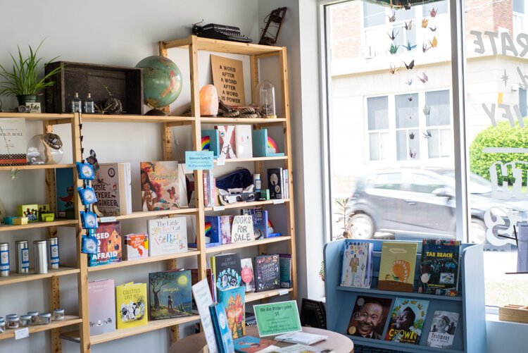 What would a reading and writing organization be without books for sale? Those available include some of cofounder Emily Kastner's published picture book series, Nerdy Babies.