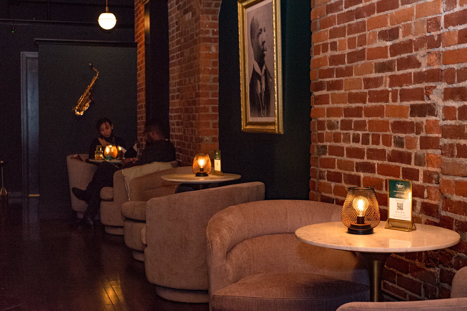 Low lighting and brick walls create a comfortable ambience at Dabney and Co.