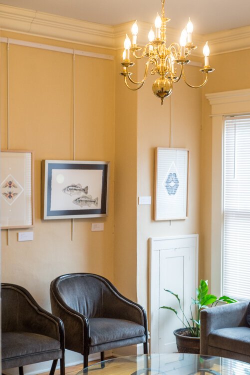 The second floor of Ninth Wave serves as a well-lit and welcoming gallery. On the wall are artwork from members of the Photosynthesis Project.