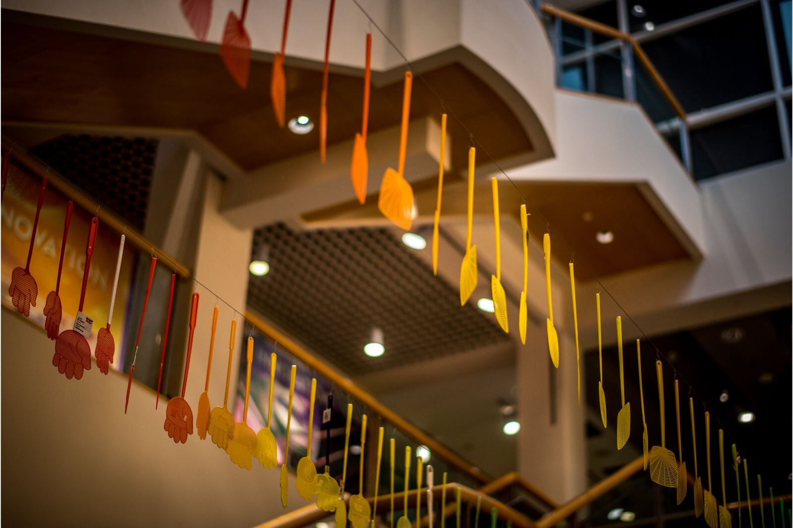  Flyswatters hang from the ceiling of the Kalamazoo Valley Museum for the “SPLAT! The Buzz About Flyswatters” exhibit until January 7, 2024.