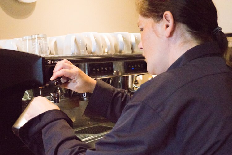 Jen Heath, a Walnut & Park barista and KPEP graduate, is perfecting her latte art