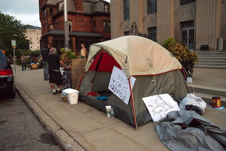 Homeless individuals invited people to talk to them during their encampment in downtown Kalamazoo in 2018.