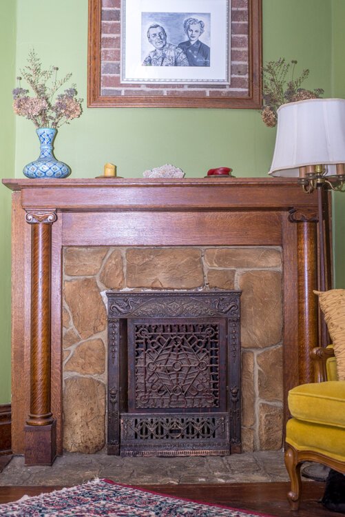 Sarah Ruggles loves the “nooks and crannies” and details, such as this stone in the original fireplace, in her 115-year-old home.