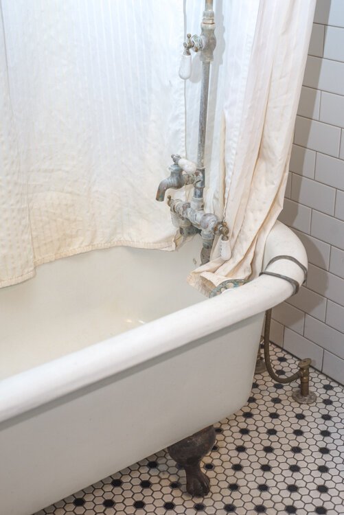 Sarah Ruggles is most proud of her bathroom renovation, which included painting the original claw foot tub and installation of period-style style.