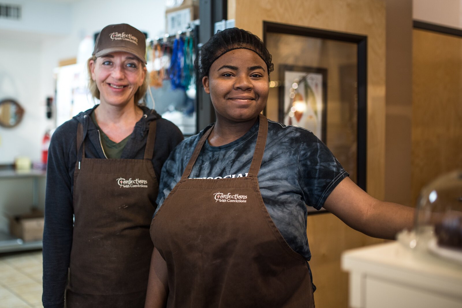 Owner Jennifer Faketty poses with an emplyeee at Confections with Convictions