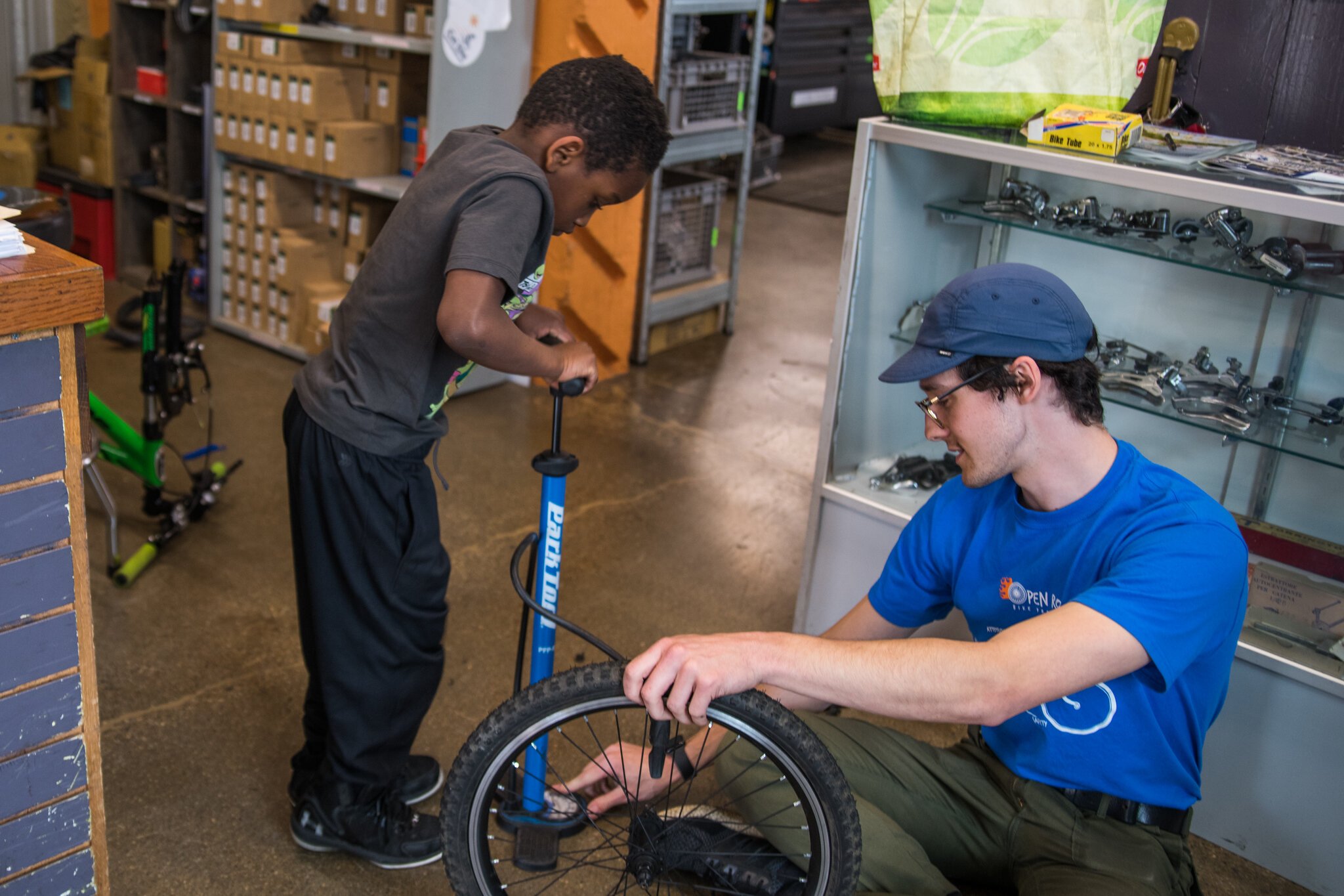 Ian Smith, Open Roads Program Manager, working on a bike.