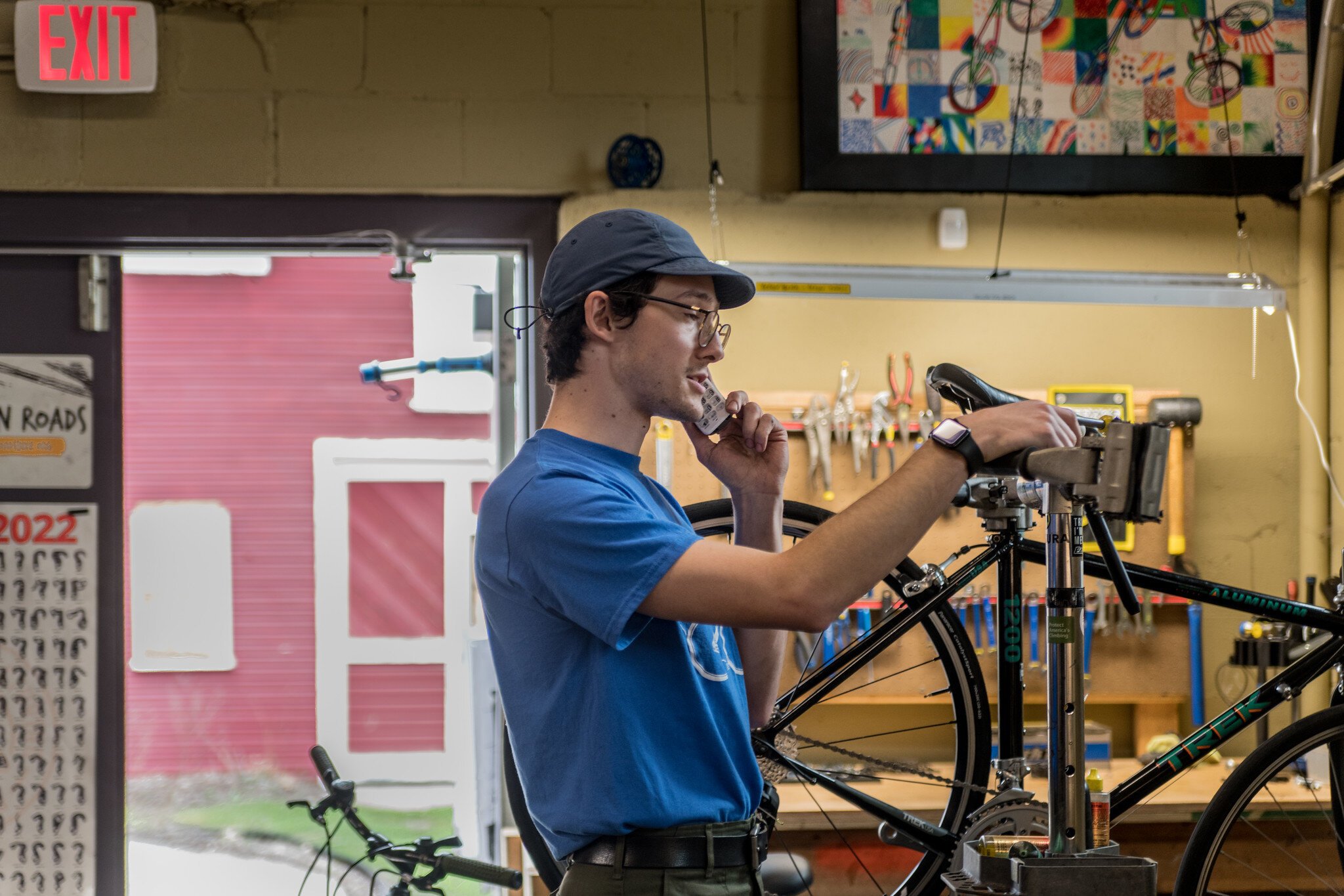 Ian Smith, Open Roads Program Manager, working on a bike.