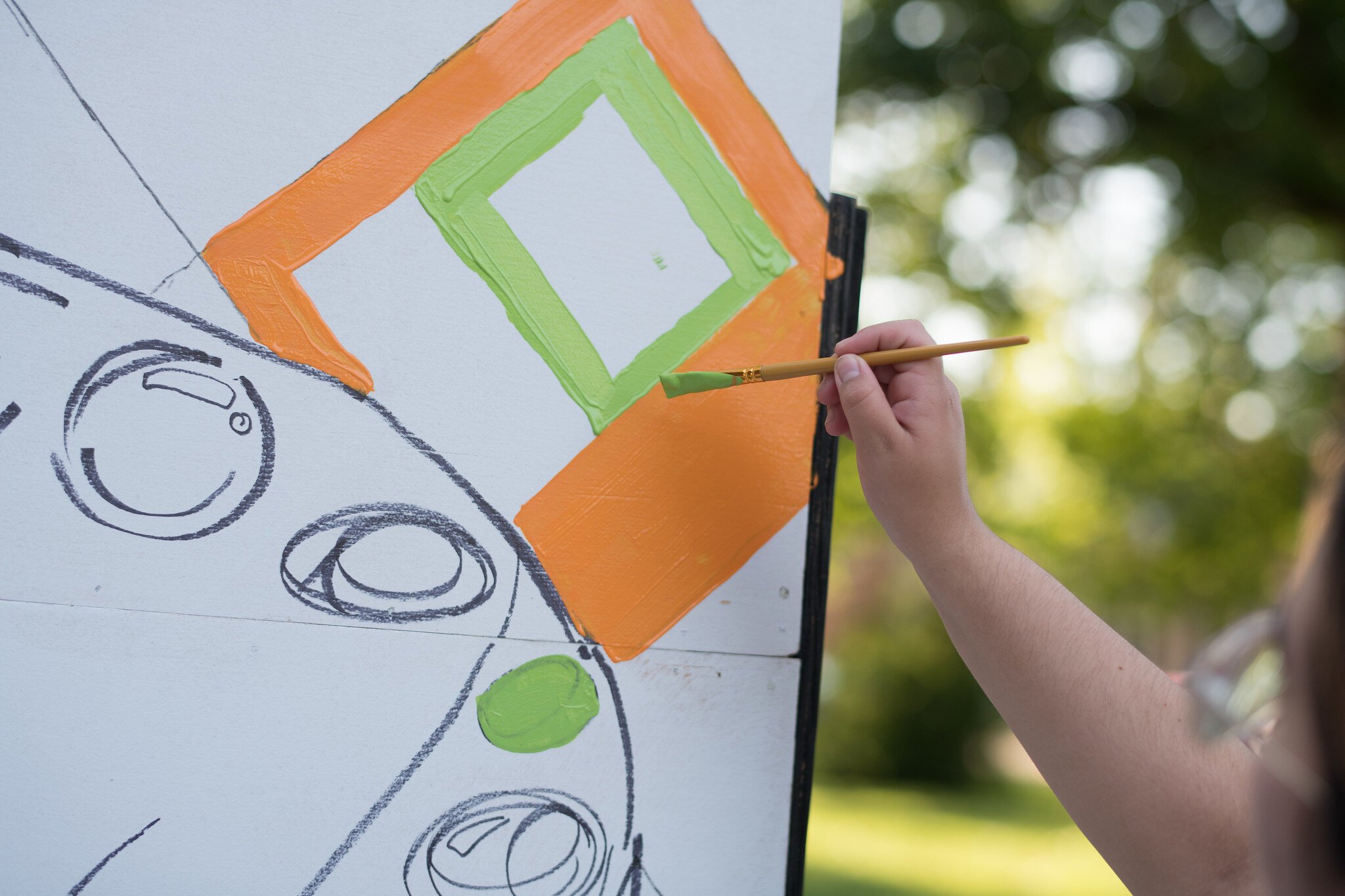 Attendees were invited to help paint the Brush the Block logo mural.