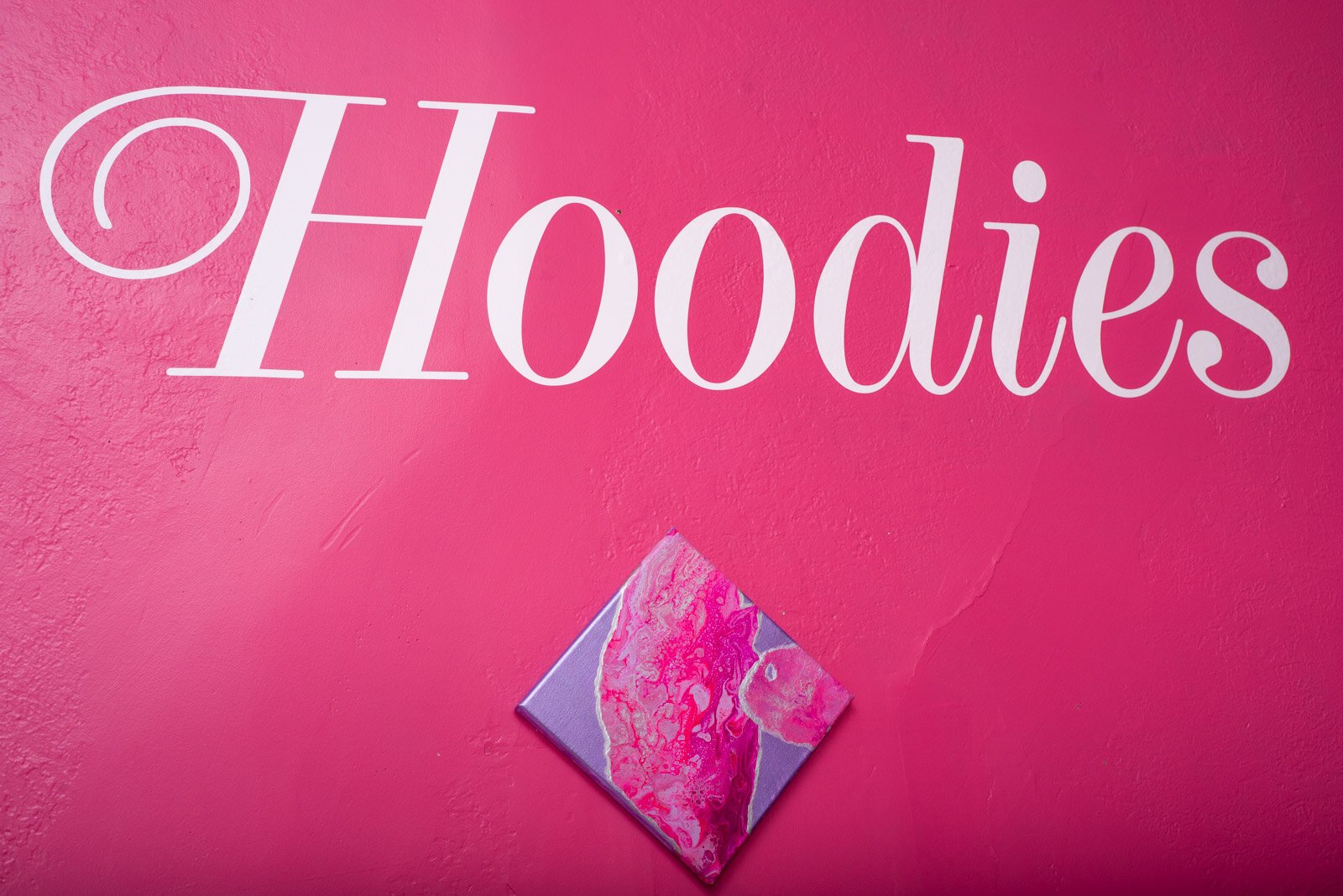 Pink is the trademark color of Hoodies, a place to eat somewhere in the Vine Neighborhood.