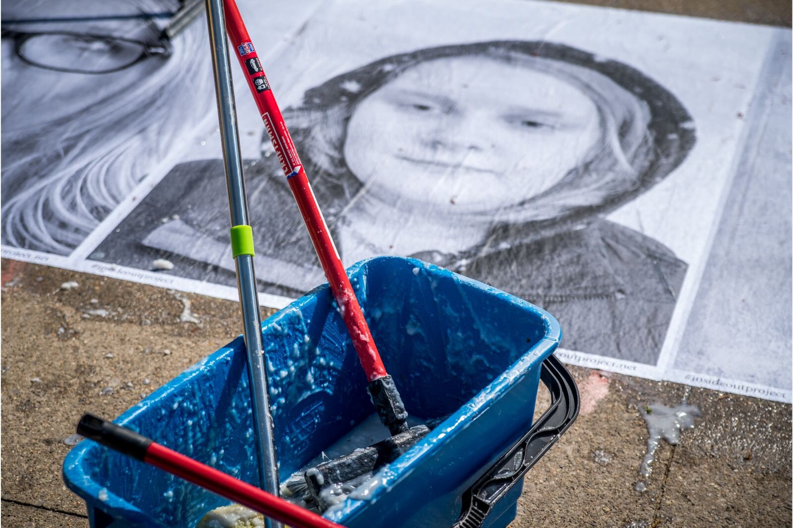 Many hands make light work. A pre-ordered, powdered wheat paste was delayed and so teachers and students made handmade paste of flour, sugar, and water.