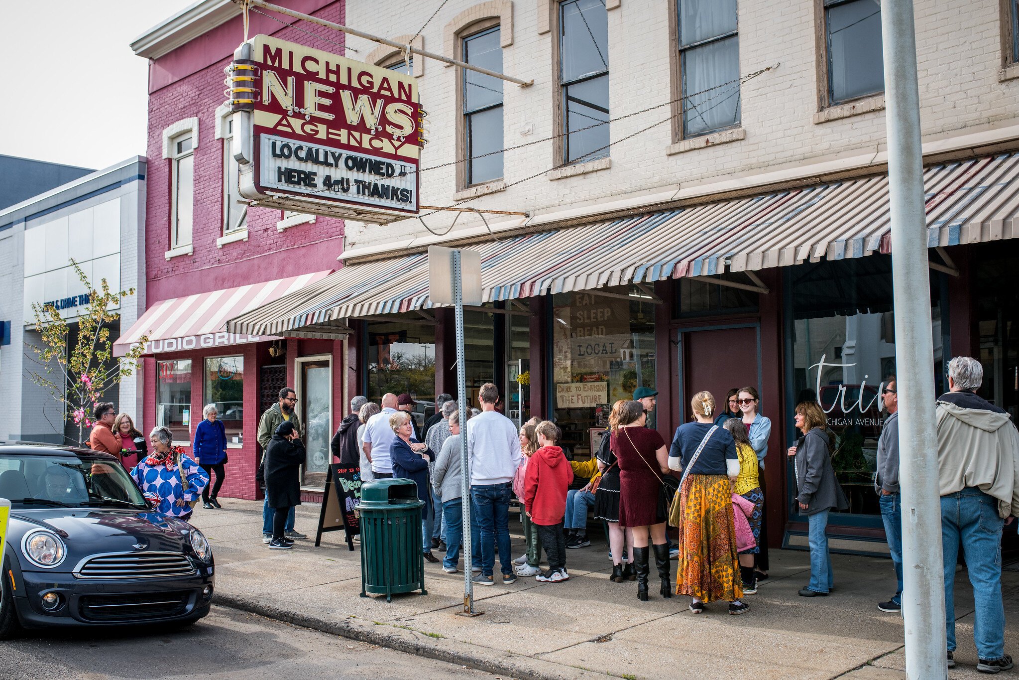 People lined up down the block to pay their respect to Dean Hauck at Michigan News Agency on Friday, May 2, 2025.