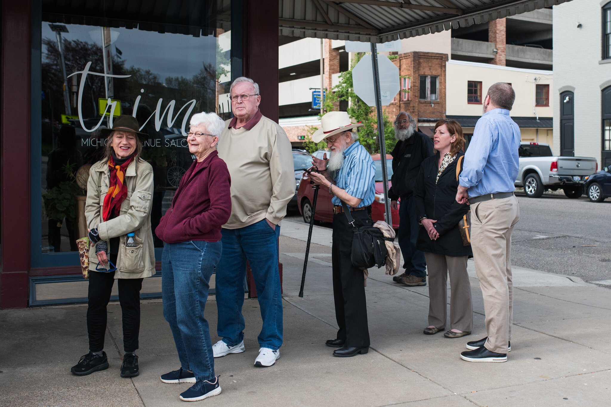 People waiting in line down the block in front of Michigan News Agency waiting to pay their respects.