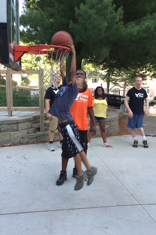 Basketball is a popular activity at Peace House whenever weather permits.