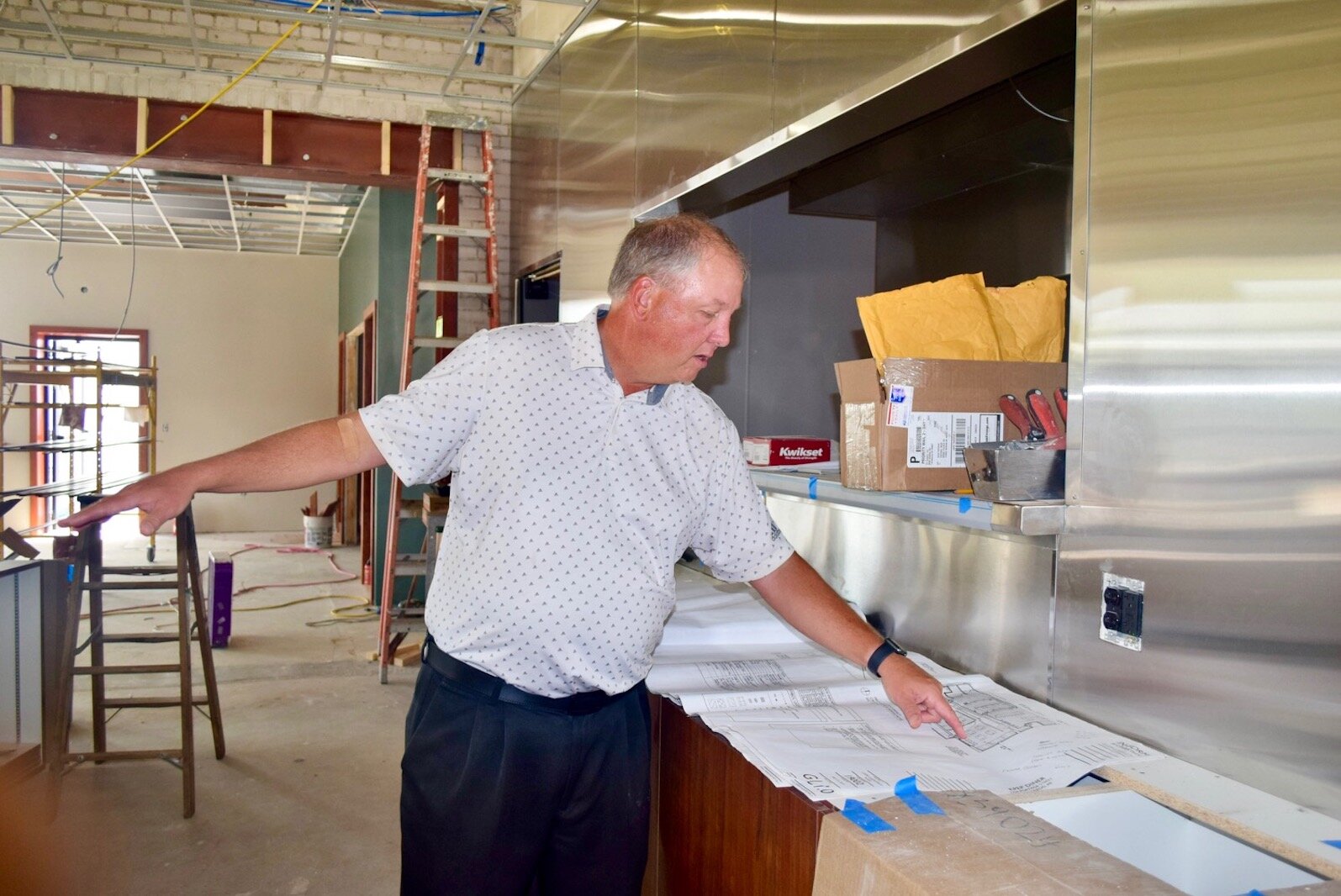 William DeBoer, president and CEO of the Kalamazoo Probation Enhancement Program, looks at renovation plans last July inside the organization’s W/P Diner @ Washington Square.