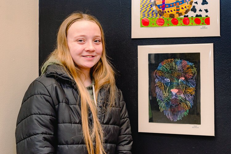 Olivia Royer from Pennfield Middle School  with her artwork, "Lion Etching."