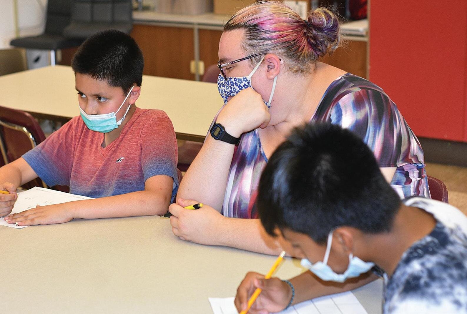 From left, Henry Ramirez Quintero, Milwood Middle School 6th graders, Emily Fall, summer class math teacher of El Concilio’s Azteca Academy, and Edwin Ramos López, Loy Norris 9th grader.